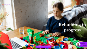 A young girl with her colourful Lego blocks, rebuilding