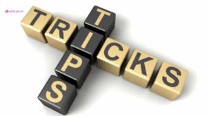 A 3D effect image features black and gold keyboard keys arranged to spell "TIPS" and "TRICKS,"