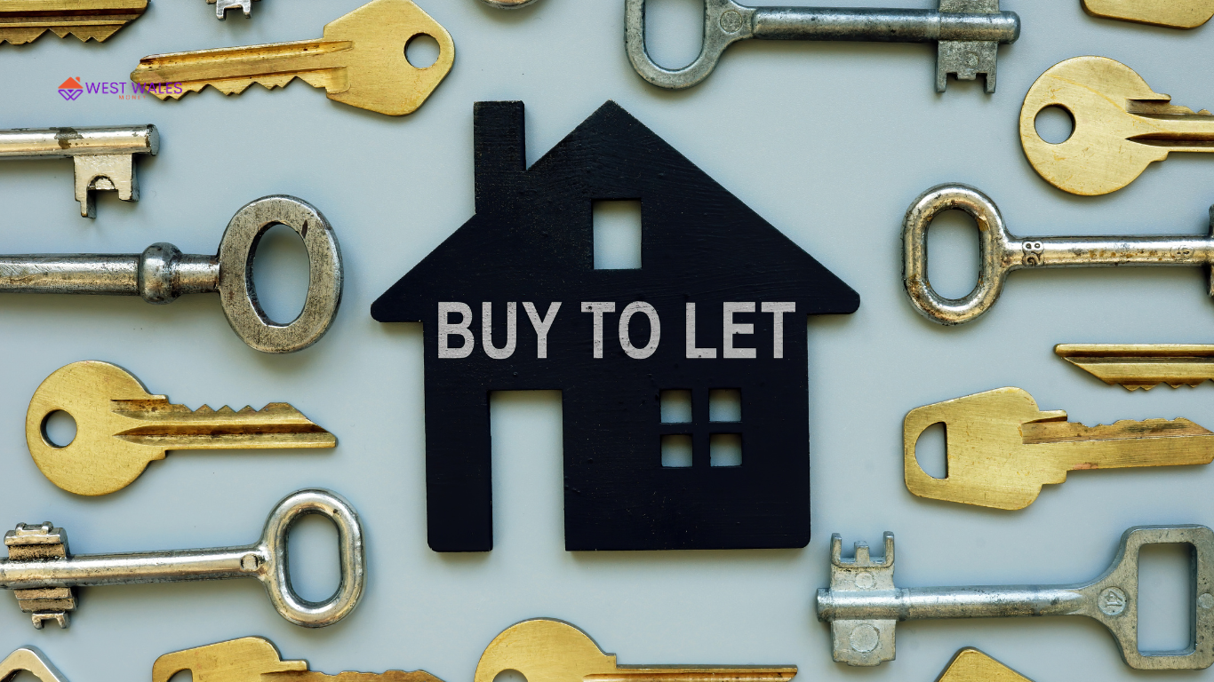 A collection of various types of keys scattered around a central black house-shaped sign. The sign reads “BUY TO LET.” The keys vary in design and size,