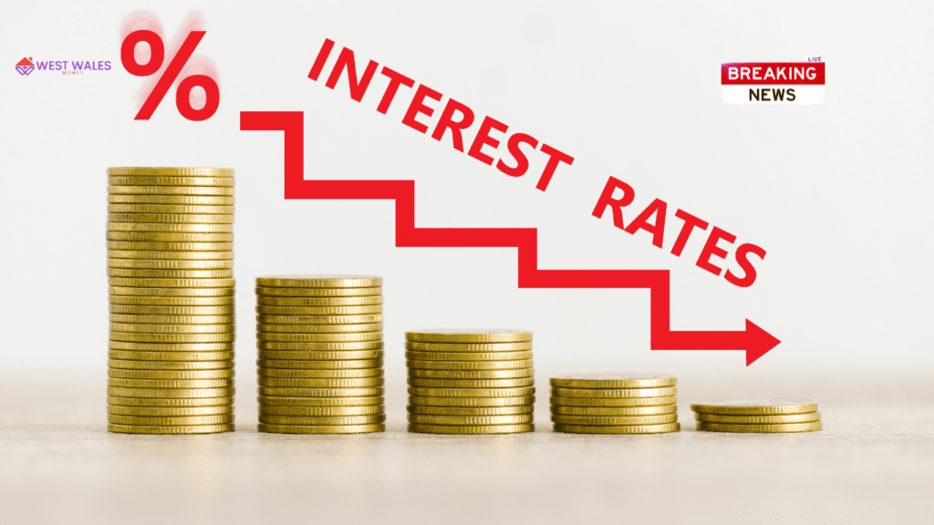 The image features a descending graph made of coins with a red arrow and the words “INTEREST RATES,” indicating a decrease in interest rates