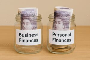 Two labelled jars or folders: one marked “Business Finances” and the other “Personal Finances” clearly separated.