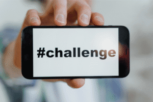 Smartphone displaying the hashtag #challenge, representing the difficulty of passing the Interest Coverage Ratio (ICR) stress test for buy-to-let mortgages