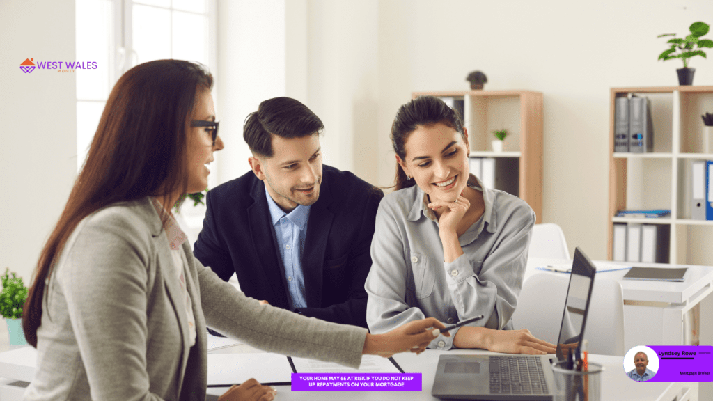 A Female Mortgage Broker advisign a young couple on a buy-to-ley mortgage.