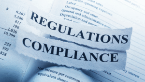 Torn paper with the words ‘Regulations’ and ‘Compliance’ symbolising landlords meeting new EPC rules and energy efficiency standards.