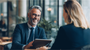Mortgage advisor offering personalised mortgage guidance to a landlord in a modern office setting.