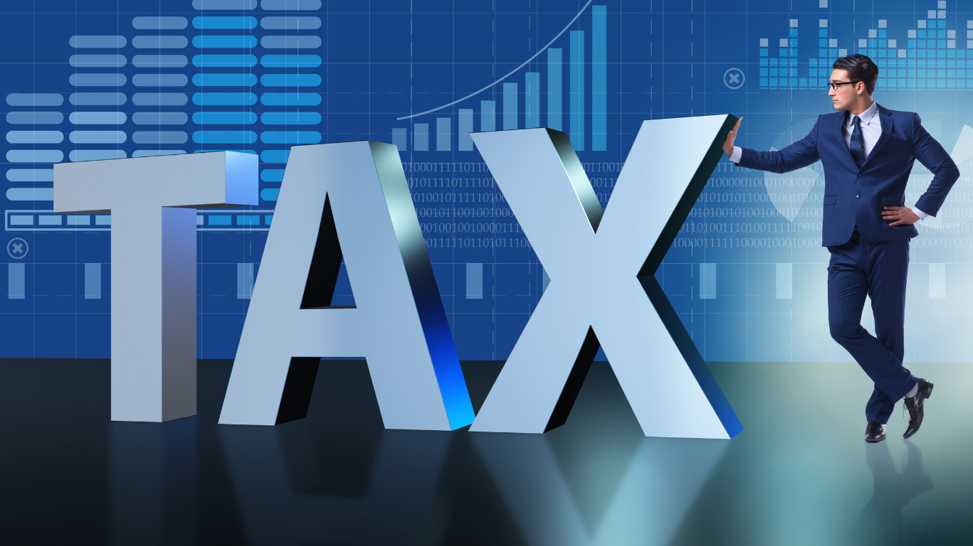 Business professional standing beside a large ‘TAX’ sign, symbolising digital transformation under Making Tax Digital and modern tax management for UK directors and landlords.