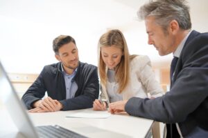 Couple meeting mortgage adviser to arrange a Decision in Principle