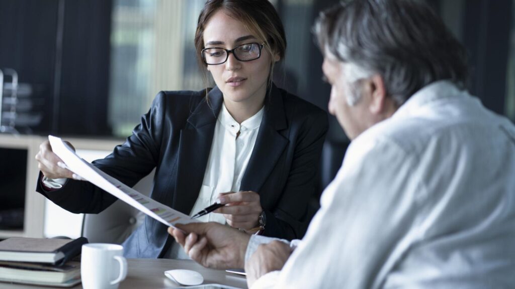 Company director discussing mortgage borrowing and business finances with a specialist mortgage adviser
