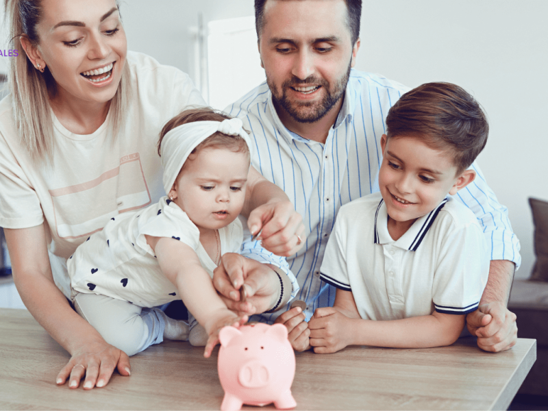 Smiling family saving money together at home, symbolising the importance of mortgage protection for long-term financial security.